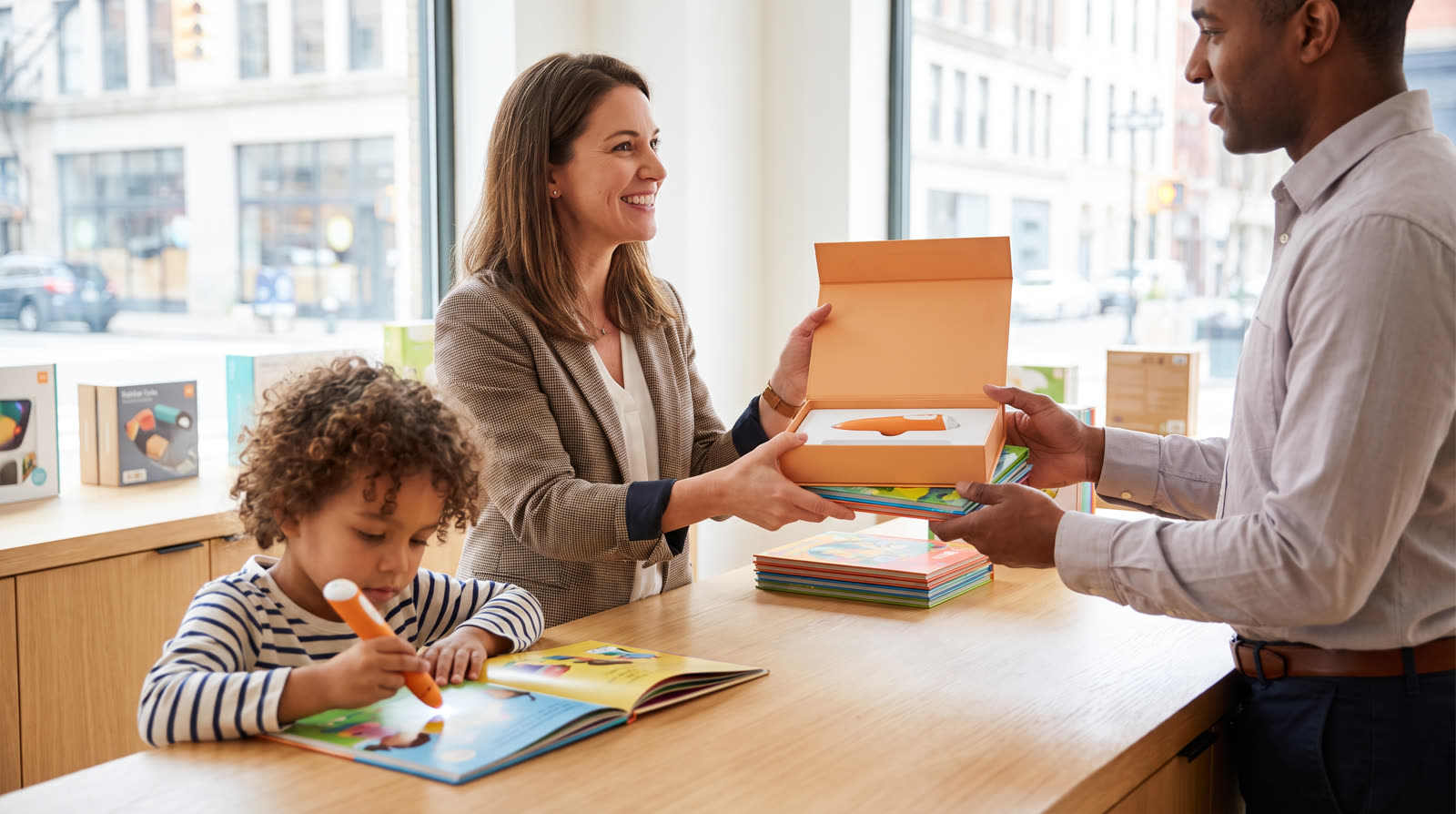 Child using an unbranded reading pen and illustrated learning materials for a talking pen demo unit buyer guide