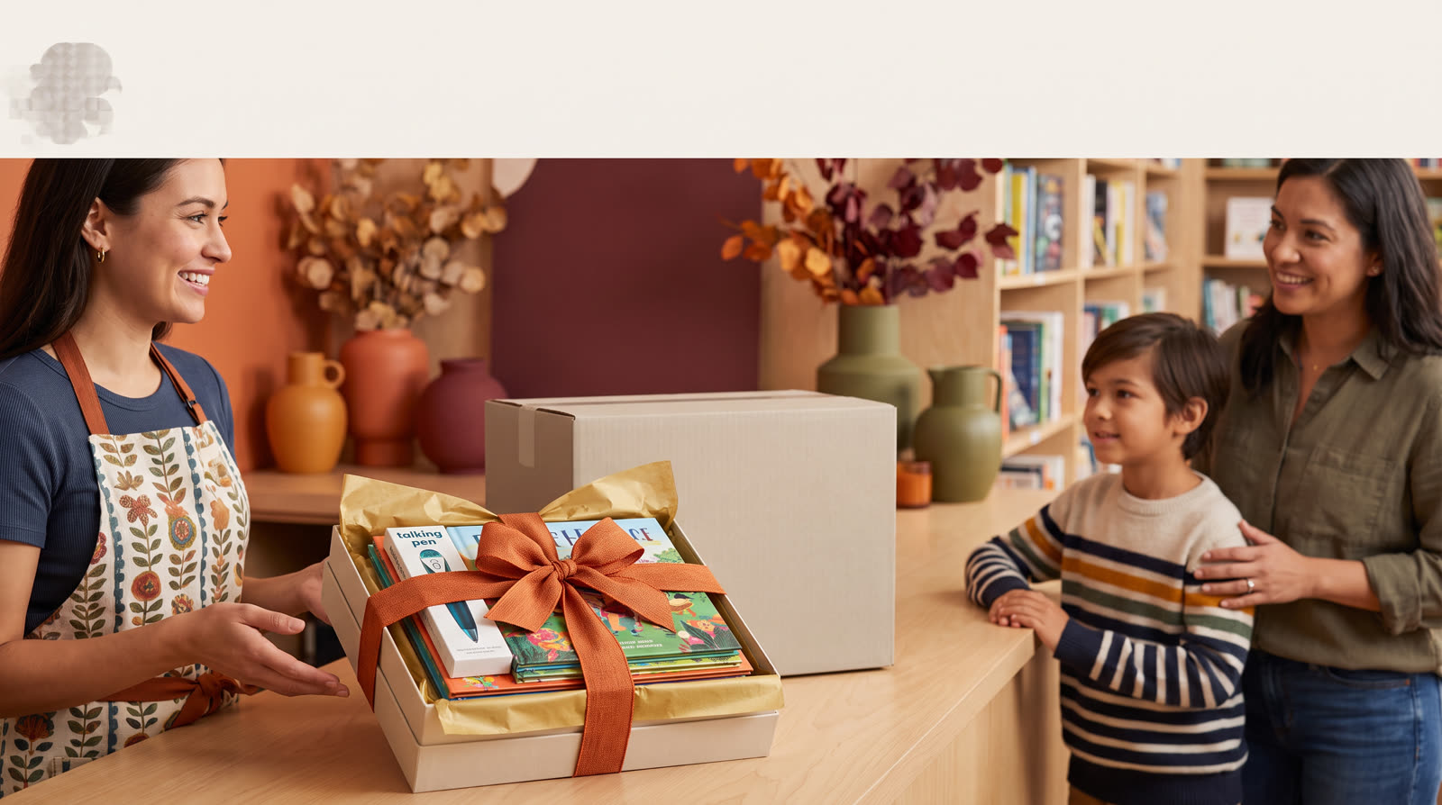 Child using an unbranded reading pen and illustrated learning materials for a gift wrapping for talking pen set buyer guide